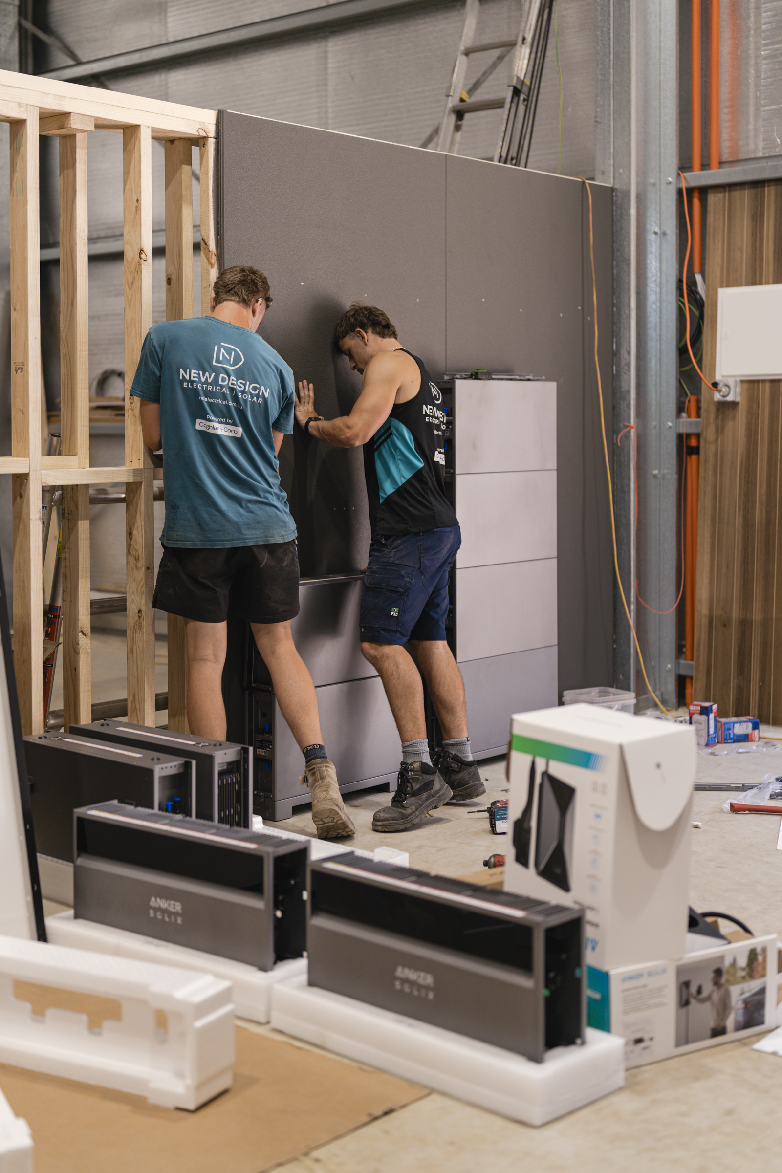 Two Anker SOLIX X1 home battery stacks during installation.