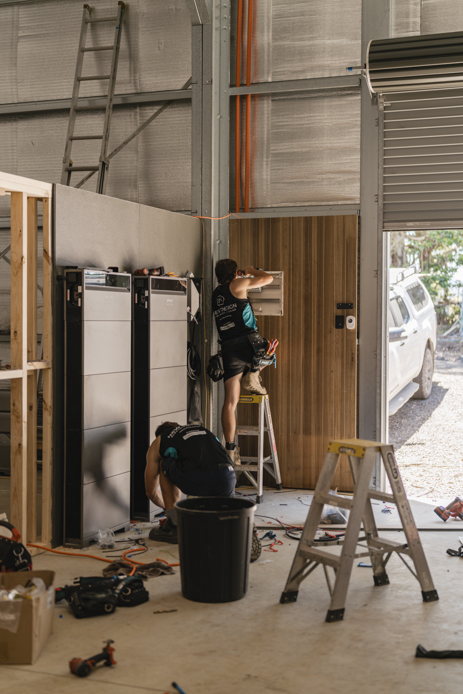Licensed electricians preparing the solar and battery infrastructure.